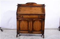 Lot 413 - An oak slimline bureau, circa 1940