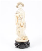 Lot 149 - Japanese carved ivory okimono, Meiji period, carved as a female garden attendant