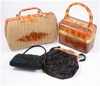 Lot 178 - A collection of vintage handbags including early plastic with integrated lace panel, wicker / cane handbags, a pink handbag made for Harrods by Widegate of London, and black beaded evening bags. (16)