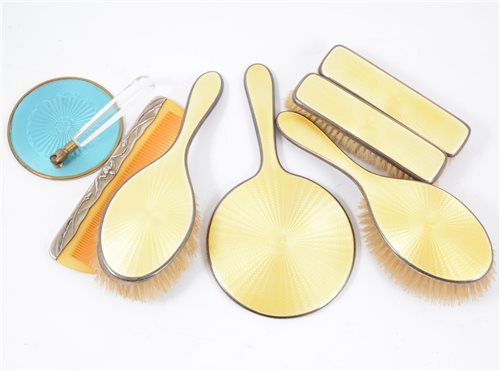 Lot 243 - Silver and yellow enamel dressing table set by W G Sothers Ltd, Birmingham 1929, along with a blue enamelled mirror and a comb. (7)