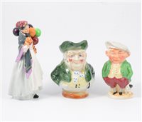 Lot 34 - Royal Doulton figure, Biddy Pennyfarthing, HN1843; four toby jugs, a figural flask and a bowl