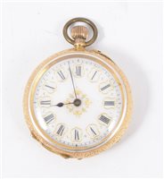 Lot 205 - A yellow metal open face fob watch, white enamel dial with a roman numeral chapter ring in a yellow metal floral engraved case marked 18k, gilded base metal inner case