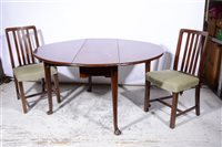 Lot 381 - A mahogany oval dropleaf dining table, and four slat-back chairs.