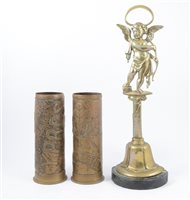 Lot 155 - A pair of brass commemorative shell cases, and a brass doorstop.