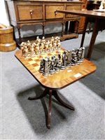 Lot 424 - A small chess table with cast metal chess set