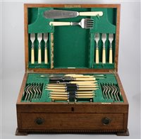 Lot 265 - An oak canteen of Walker & Hall silver-plated cutlery, six place settings in the rat-tail design