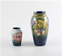Lot 11 - A Moorcroft 'Clematis' vase, 18cm, signed in green WM, impressed Moorcroft Made in England and a Moorcroft 'Poppy' vase, 9.5cm, impressed Moorcroft Made in England (2).