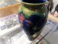 Lot 11 - A Moorcroft 'Clematis' vase, 18cm, signed in green WM, impressed Moorcroft Made in England and a Moorcroft 'Poppy' vase, 9.5cm, impressed Moorcroft Made in England (2).
