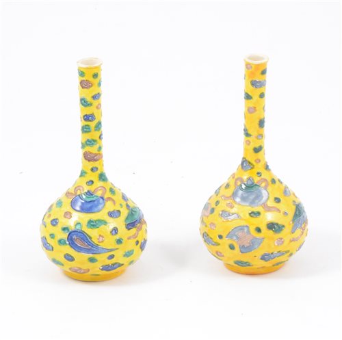 Lot 19 - Near pair of Chinese yellow ground bottle vases, 16cm