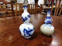 Lot 23 - Chinese blue and white double gourd-shape vase, and a Chinese blue, white and celadon bottle vase