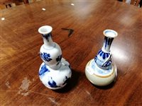 Lot 23 - Chinese blue and white double gourd-shape vase, and a Chinese blue, white and celadon bottle vase