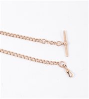 Lot 193 - A 9 carat rose gold single albert watch chain, graduated curb links fitted with a T bar and swivel, overall length 40cm, approximate weight 22gms.