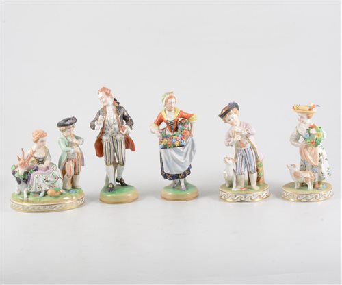 Lot 20 - Pair of Dresden porcelain figures, 20th Century, modelled as a gentleman taking snuff and a flower girl,  18cm; another pair of Dresden figurines, a girl with a lamb, boy with a dog, 15cm and a Dre...