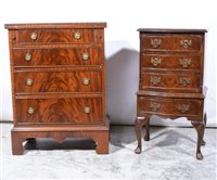 Lot 397 - Reproduction mahogany bachelors chest, with a fold-over top, fitted with four graduating drawers, bracket feet, width 59cm; and a reproduction walnut bowfront chest on stand, width 41cm, (2)