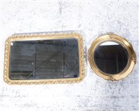 Lot 155 - Reproduction gilt framed wall mirror, rectangular plate, leaf moulded outlines, 58 x 84cm;  a circular gilt framed wall mirror; and a reproduction oak wall barometer, (3)