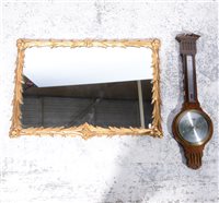 Lot 155 - Reproduction gilt framed wall mirror, rectangular plate, leaf moulded outlines, 58 x 84cm;  a circular gilt framed wall mirror; and a reproduction oak wall barometer, (3)