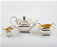 Lot 266 - Edwardian three-piece silver teaset, James Dixon & Son, Sheffield 1905-6, of shaped rectangular form with gadrooned outlines, including a teapot, 15cm, 28oz gross.