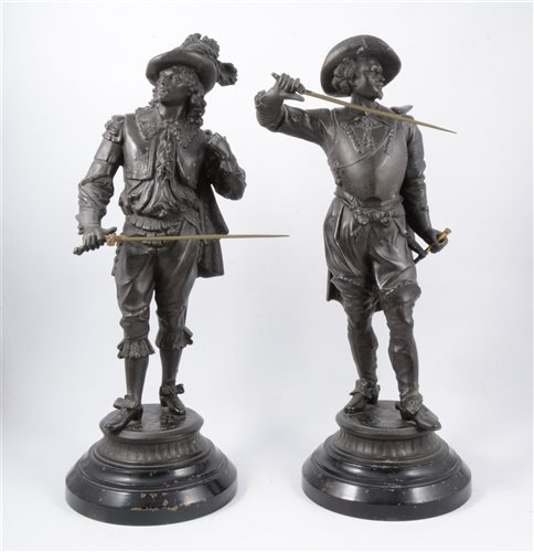 Lot 92 - A pair of patinated spelter figures, of Cavaliers, raised on ebonised socles (2)