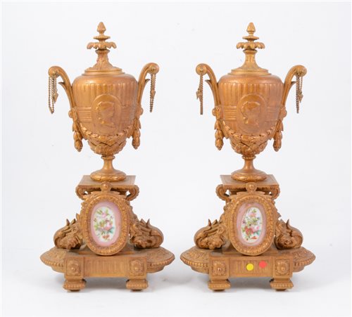 Lot 94 - Two gilt metal garnitures inset with porcelain plaques