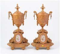 Lot 94 - Two gilt metal garnitures inset with porcelain plaques