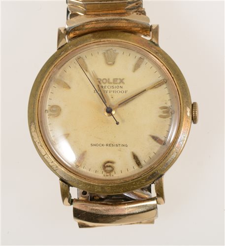 Lot 321 - Rolex - A gentleman's Precision Dustproof Shock Resisting wrist watch, 28mm circular baton dial with quarter arabics and centre seconds hand in a gold-plated case with stainless steel back