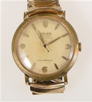 Lot 321 - Rolex - A gentleman's Precision Dustproof Shock Resisting wrist watch, 28mm circular baton dial with quarter arabics and centre seconds hand in a gold-plated case with stainless steel back