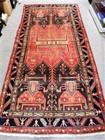 Lot 446 - A Baluchi carpet.