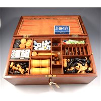 Lot 206 - Games compendium, with draughts, backgammon, dominoes, chess pieces and board, lead horse figures, etc, 34cm wide, 20cm deep, 11cm tall.