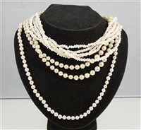 Lot 308 - A collection of pearl necklaces, a five row freshwater pearl necklace, a single row cultured pearl necklace with eighty 6mm pearls knotted every pearl into a necklace 55cm long