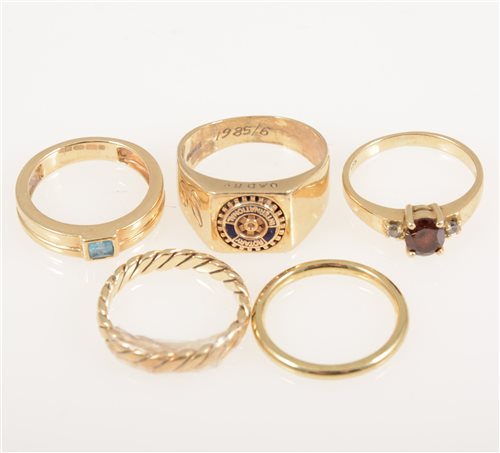 Lot 229 - Five gold rings, a 9 carat yellow gold signet ring with a "Rotary Club" emblem to head, ring size N, approximate weight 5.5gms, a 585 standard gemset ring 2gms