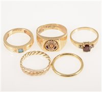 Lot 229 - Five gold rings, a 9 carat yellow gold signet ring with a "Rotary Club" emblem to head, ring size N, approximate weight 5.5gms, a 585 standard gemset ring 2gms