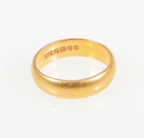 Lot 232 - A 22 carat  yellow gold wedding band, 4.7mm wide plain polished D shape, hallmarked London 1968, ring size J1/2, approximate weight 5gms.