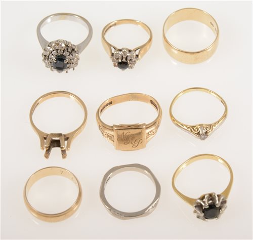 Lot 241 - .Nine various gold rings, a small diamond solitaire marked 18ct approximate weight 2.3gms, an 18ct white gold ring wedding band 3.9gms,, two 9ct yellow gold wedding rings