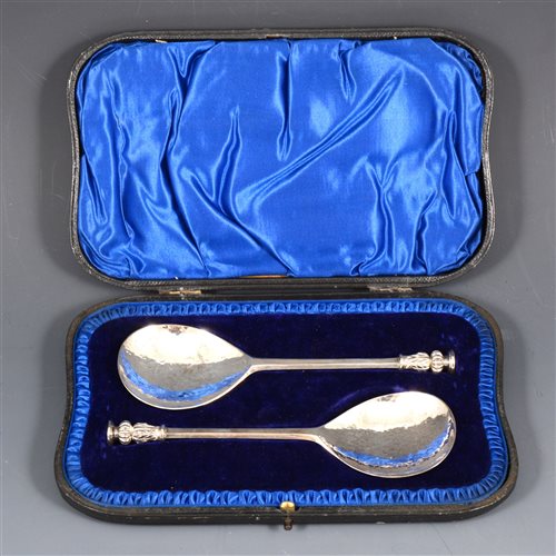 Lot 184 - A pair of silver seal top spoons by Atkin Brothers, hand-beaten finish to bowls, in fitted blue velvet case, Sheffield 1907, total weight approx. 3.8oz.