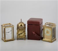 Lot 152 - Brass carriage clock, enamelled dial, 15cm, leather travelling case, another brass cased carriage clock and a miniature lantern clock with battery movement, (3).