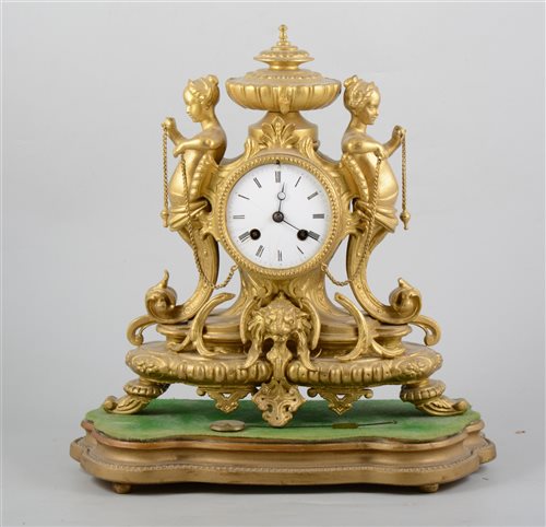Lot 144 - 19th Century French gilt spelter mantel clock, circular enamelled dial (cracked),  silk suspension, cylinder movement striking on a bell, 32cm, on a gilt serpentine plinth.