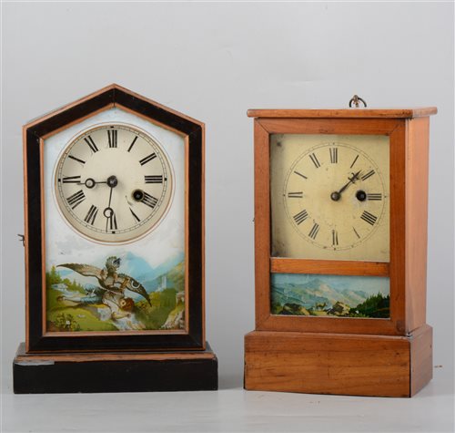 Lot 145 - Two American shelf clocks, one in a painted architectural case, printed glass door, 30cm, the other in a rectangular walnut case, glazed door, 27cm, (2).