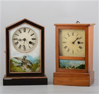 Lot 145 - Two American shelf clocks, one in a painted architectural case, printed glass door, 30cm, the other in a rectangular walnut case, glazed door, 27cm, (2).