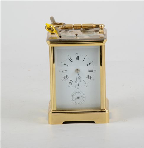 Lot 150 - French brass cased carriage clock, the case with printed panels, repeating movement striking on a gong, with alarm, 15cm.
