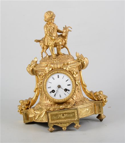 Lot 135 - 19th Century French gilt spelter mantel clock, the case designed with a boy and a goat, circular enamelled dial, French cylinder movement striking on a bell, the case with one rear foot damaged, 36cm.