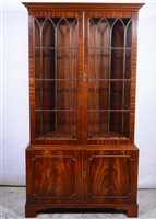 Lot 416 - Reproduction mahogany bookcase, glazed doors above cupboard, bracket feet, width 101cm, depth 36cm, height 186cm.