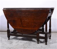 Lot 387 - Joined oak table, oval top with two drop leaves, turned gatelegs, 106cm.