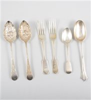 Lot 281 - Set of six silver table forks by Henry and John Lias, London 1870, Fiddle pattern with engraved crest, 15oz; set of six Victorian silver Fiddle pattern dessert spoons; pair of silver berry spoons,...