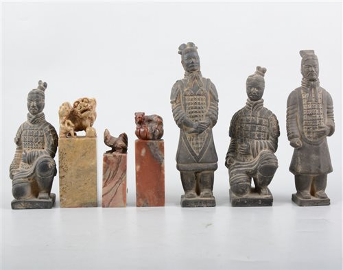 Lot 231 - Three Chinese carved hardstone seals, and four miniature terracotta warrior models, along with a Japanese silk panel from a kimono measuring 56.5cm by 26.5cm, (8).