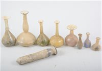 Lot 230 - A Roman style glass bottle vase, 11cm, and a small collection of other similar glass vases, various sizes.