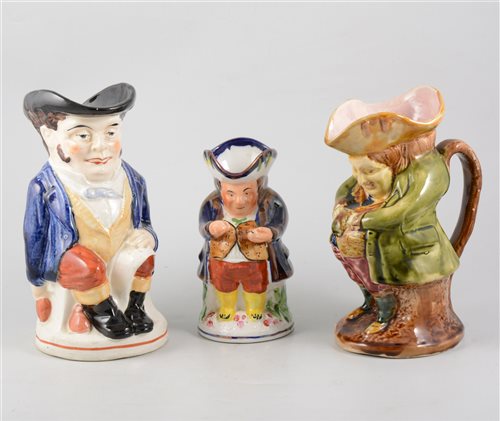 Lot 91 - Staffordshire pottery toby jug, Mr Toby standing, 23cm, other toby and character jugs and a novelty teapot.