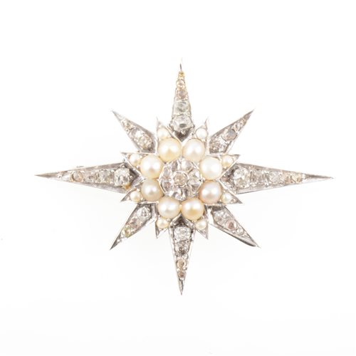 Lot 180 - A diamond and pearl eight ray star brooch.