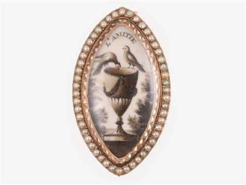 Lot 178 - A 19th century rose metal mounted Memento Mori navette shaped brooch