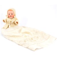 Lot 228 - Heubach Koppelsdorf Germany bisque head baby doll, head stamp 415 13/0, with sleeping eyes, open mouth and composition body, in what looks like an original outfit, 22cm tall.