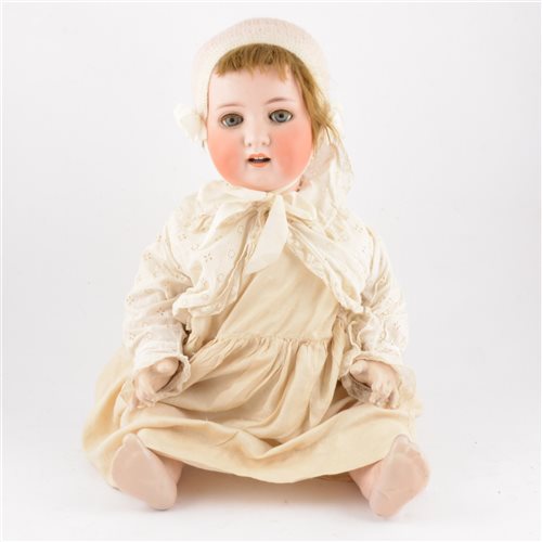 Lot 218 - Heubach Koppelsdorf Germany bisque head doll, head stamp 300.9 with open mouth and sleeping eyes, composition body, with what appears to be an original outfit, 65cm tall.